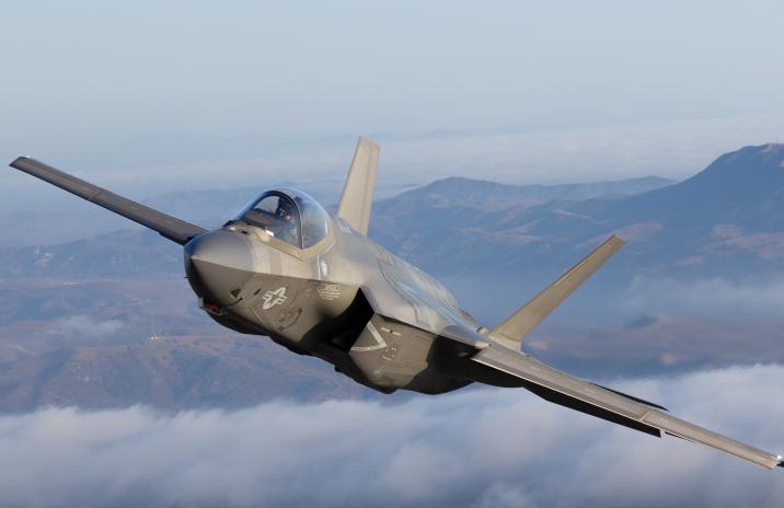 Very close top view of a F-35C Lightning II over clouds