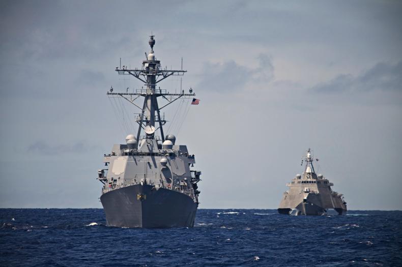 A USS Destroyer and Littoral Combat Ship hunt together in the South Pacific