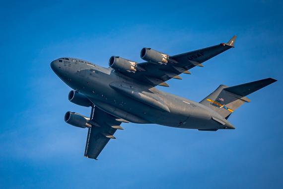 USAF cargo aircraft in flight, representing contested logistics and the importance of logistics simulation software and modeling for mission readiness