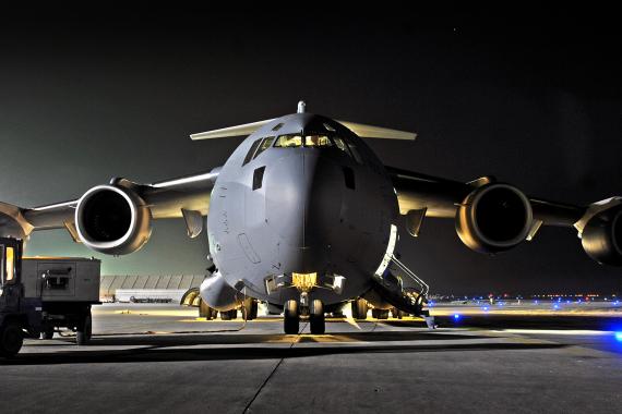 Military cargo aircraft at night, highlighting contested logistics and the role of logistics simulation software and modeling in mission sustainment